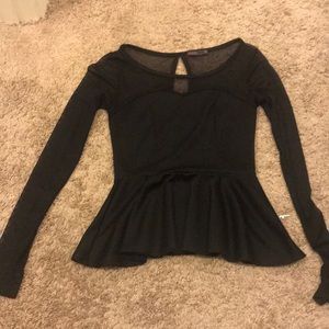 Peplum mesh accent black top